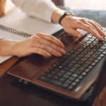 Person typing on laptop